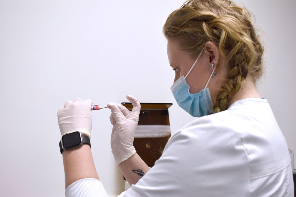 MedQuest Veterinary Technology student working with specimen