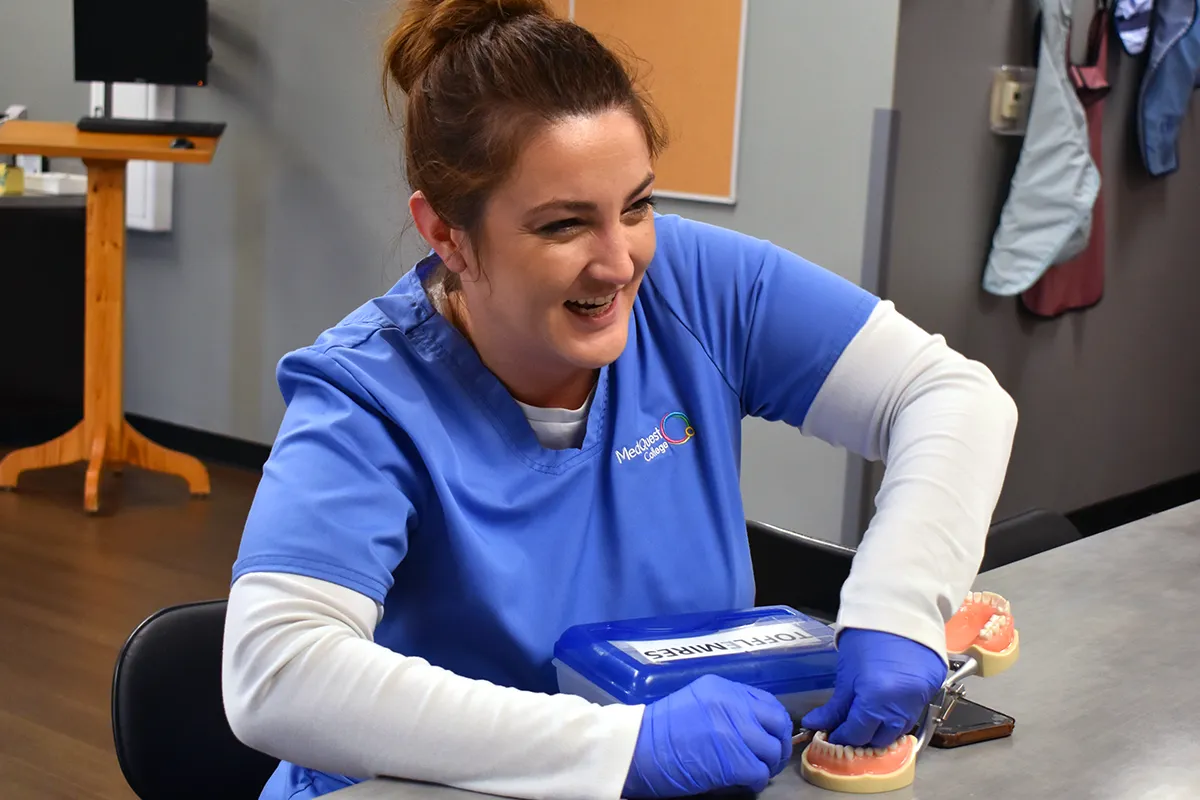dental hygienist student working with tools