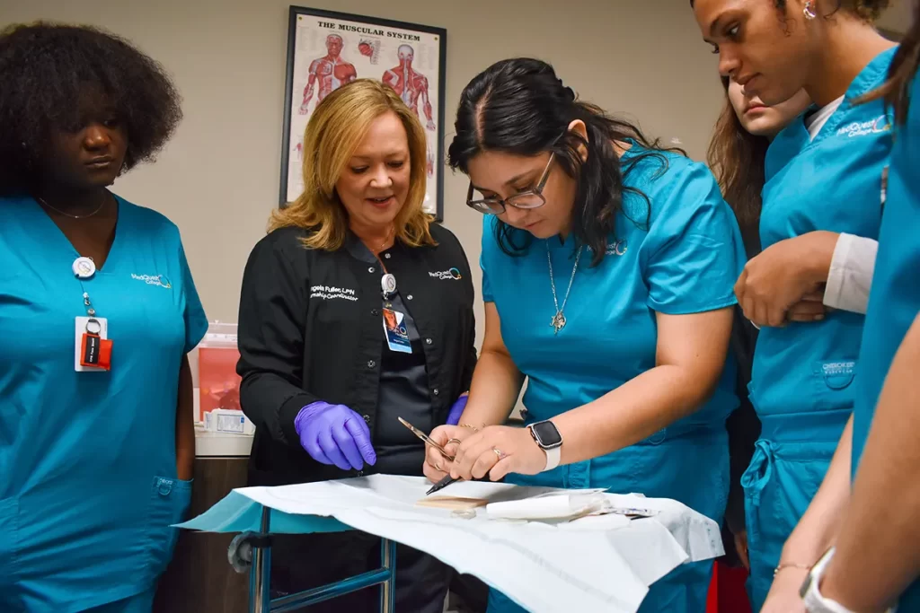 medical assistant students and teacher working together