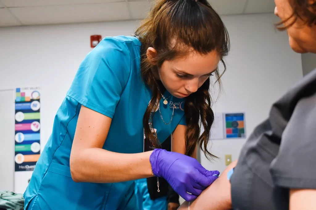 medical assistant student drawing blood