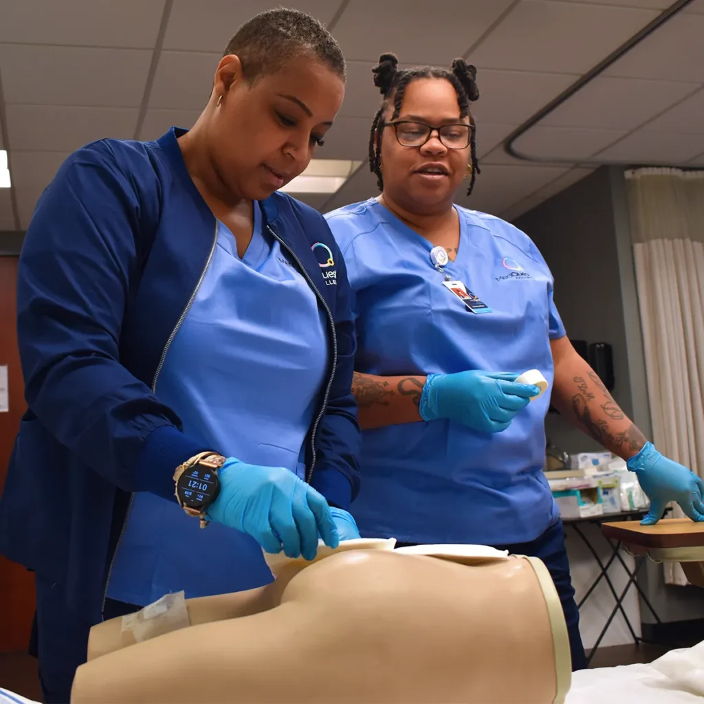 MedQuest Practical Nursing student working on a mannequin